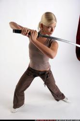 Woman Young Athletic White Fighting with sword Standing poses Sportswear