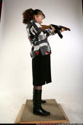 Woman Old Average White Fighting with submachine gun Standing poses Casual