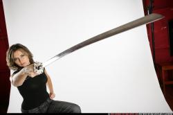 Woman Adult Average White Fighting with sword Standing poses Casual