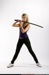 Woman Adult Athletic White Fighting with sword Standing poses Sportswear