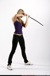 Woman Adult Athletic White Fighting with sword Standing poses Sportswear