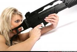 Woman Young Athletic White Fighting with submachine gun Laying poses Sportswear