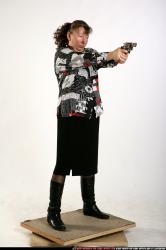 Woman Old Average White Fighting with gun Standing poses Casual