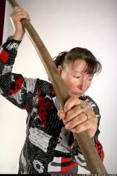 Woman Old Average White Fighting with spear Standing poses Casual