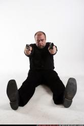 Man Old Chubby White Fighting with gun Laying poses Casual