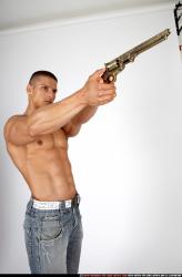Man Adult Muscular White Fighting with gun Sitting poses Pants
