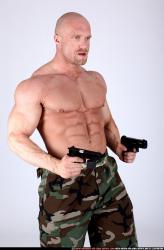 Man Adult Muscular White Fighting with gun Sitting poses Army