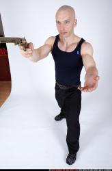 Man Adult Muscular White Fighting with gun Standing poses Sportswear