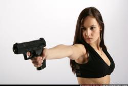 Woman Young Athletic White Fighting with gun Standing poses Sportswear