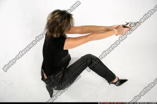 2009 10 WOMAN KNEELING SHOOTING REVOLVER 18.jpg