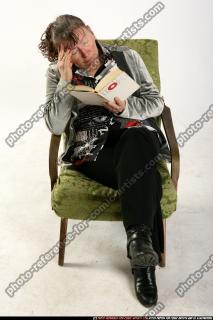 Paula-sitting-reading-sad