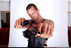 Man Adult Muscular White Fighting with gun Standing poses Casual