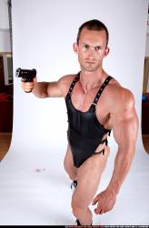 Man Adult Muscular White Fighting with gun Standing poses Casual