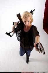 Woman Young Athletic White Fighting with gun Standing poses Casual