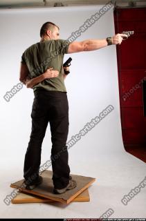 AIDEEN-STANDING-AIMING-GUNS