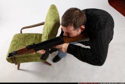 Man Adult Chubby White Fighting with submachine gun Kneeling poses Casual