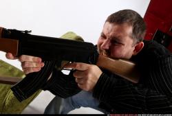 Man Adult Chubby White Fighting with submachine gun Kneeling poses Casual