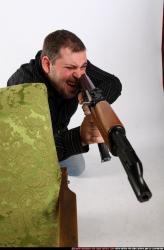 Man Adult Chubby White Fighting with submachine gun Kneeling poses Casual