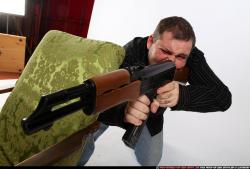 Man Adult Chubby White Fighting with submachine gun Kneeling poses Casual