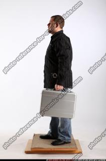 daniel-standing-suitcase
