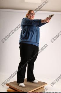 2010 07 BRITNEY STANDING AIMING PISTOL 07 C