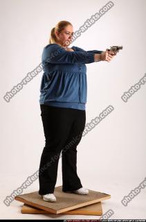 2010 07 BRITNEY STANDING AIMING PISTOL 07 B