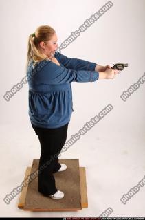 britney-standing-aiming-pistol