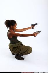 Woman Adult Athletic Black Fighting with gun Kneeling poses Army