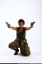 Woman Adult Athletic Black Fighting with gun Kneeling poses Army