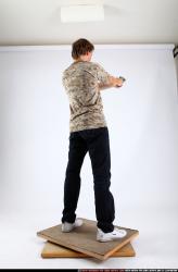 Man Young Athletic White Fighting with gun Standing poses Sportswear