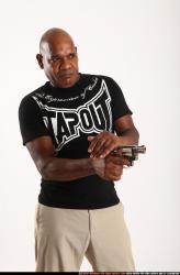 Man Old Average Black Fighting with gun Standing poses Casual