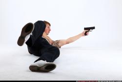 Man Young Athletic White Fighting with gun Laying poses Sportswear