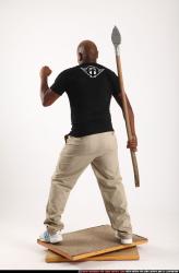 Man Old Average Black Fighting with spear Standing poses Casual