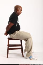 Man Old Average Black Neutral Sitting poses Casual