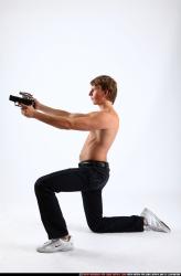 Man Young Athletic White Fighting with gun Kneeling poses Pants