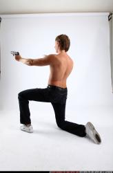 Man Young Athletic White Fighting with gun Kneeling poses Pants