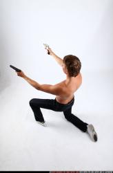 Man Young Athletic White Fighting with gun Kneeling poses Pants