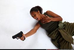 Woman Young Athletic Black Fighting with gun Laying poses Army