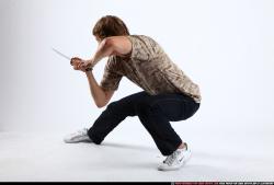 Man Young Athletic White Fighting with sword Kneeling poses Sportswear