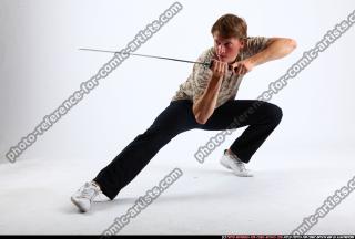 2010 10 PATRICK KNEELING KATANA DEFEND POSE 07