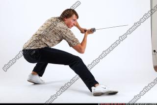 2010 10 PATRICK KNEELING KATANA DEFEND POSE 05