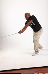 Man Old Average Black Fighting with sword Standing poses Casual