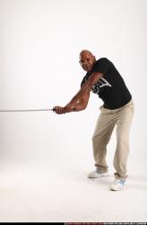 Man Old Average Black Fighting with sword Standing poses Casual