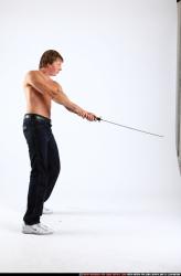 Man Young Athletic White Fighting with sword Standing poses Pants