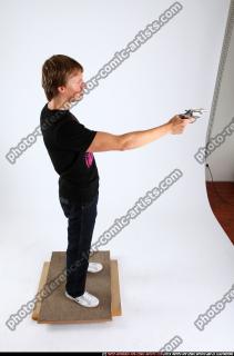 2010 11 PATRICK STANDING SHOOTING REVOLVER POSE2 06 A