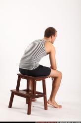 Man Adult Athletic White Neutral Sitting poses Sportswear