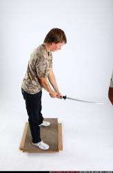 Man Young Athletic White Fighting with sword Standing poses Casual