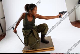 2010 12 JENNA KNEELING KATANA PISTOL 09