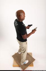 Man Old Chubby Black Fighting with gun Standing poses Casual