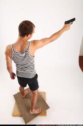 Man Adult Athletic White Fighting with gun Standing poses Sportswear